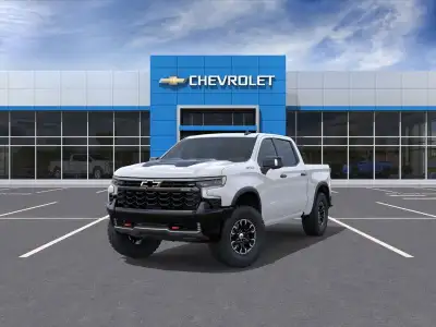 The 2025 Chevrolet Silverado 1500 ZR2, wrapped in a classic white exterior and equipped with a robus...