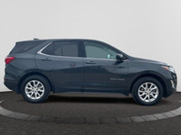 Offering excellent driving manners, this Chevrolet Equinox is Nightfall Grey Metallic in color and i... (image 5)