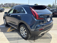 Finished in Twilight Blue Metallic and riding on stylish 18-inch aluminum wheels, this 2021 Cadillac... (image 5)