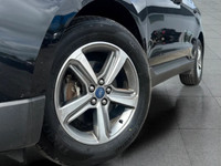 Up for sale is a well-maintained 2019 Ford Edge SEL, featuring a sleek black exterior and a rare tan... (image 1)