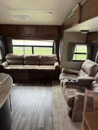 This opposing slides trailer is sure to impress anybody that walks through the door! This rear livin... (image 8)