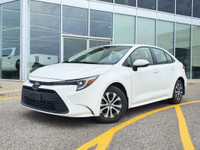Check out this 2023 Toyota Corolla Hybrid LE CVT with 27,670 KMS, finished in a sleek White exterior... (image 1)