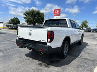 Experience the versatility of this 2022 Honda Ridgeline Touring Crew Cab Pickup, boasting a robust a... (image 4)