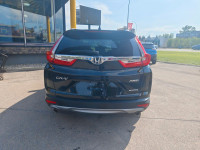 Summary The Touring represents the pinnacle of the 2019 CR-V lineup, offering a refined blend of per... (image 9)