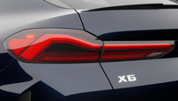 La conception audacieuse du *BMW X6 M60i 2025* est indéniable. Du toit de type coupé au profil cisel... (image 9)