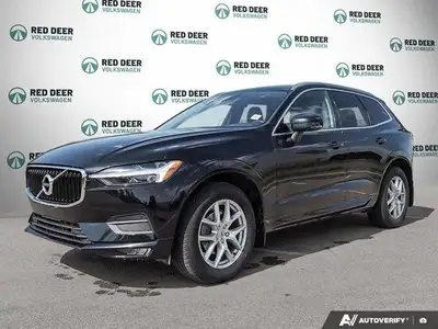 The 2021 Volvo XC60 T5 AWD Momentum is a sophisticated black SUV that offers an impeccable balance o...