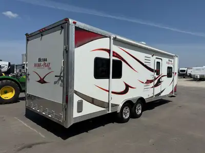 The 2012 Forest River Work and Play Ultra 25ULA is a compact yet capable toy hauler that blends dura...