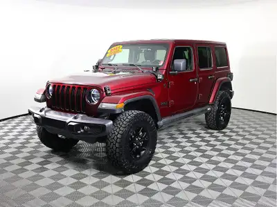 Dare to drive our iconic 2021 Jeep Wrangler Unlimited Sahara Altitude 4 Door 4X4 in Firecracker Red...