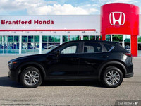 Experience the confident handling and sleek style of this 2024 Mazda CX-5 GS. Boasting a low 35,730k... (image 1)