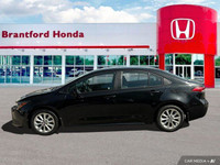 This sleek 2022 Toyota Corolla LE sedan in Black Sand Pearl is ready to enhance your daily commute.... (image 1)