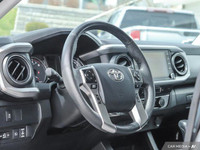 From work to weekends, this previous daily rental Black 2023 Toyota Tacoma muscles through any terra... (image 8)