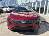 Finished in a head-turning Radiant Red Tricoat with a sleek Noir interior, the 2025 Cadillac Optiq E... (image 1)