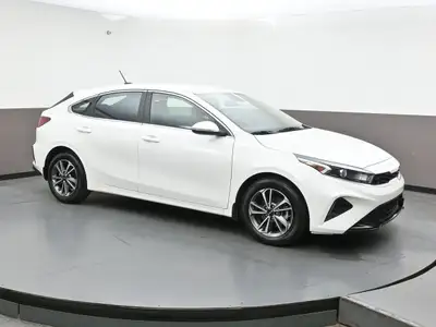 Experience refined performance and modern comfort with the 2024 Kia Forte 5 EXâ€”a sleek, sporty hat...