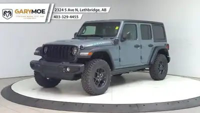The 2025 Jeep Wrangler 4xe 4-Door Willys, in a striking gray, is a new adventure-ready 4x4 SUV that...