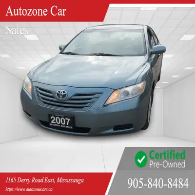 This 2007 Toyota Camry is a reliable sedan with a sleek green exterior and a comfortable gray interi...