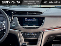 The 2023 Cadillac XT5 AWD Sport in a sleek black exterior blends luxury and performance with all-whe... (image 9)
