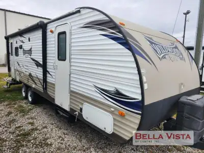 The Wildwood X-Lite 252RLXL travel trailer by Forest River offers two entrances, and a rear living a...