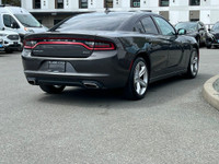 This 2018 Dodge Charger SXT has a Grey Exterior and Cream Interior with seating for 5. Equipped with... (image 7)