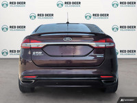 Explore the exceptional performance of the 2018 Ford Fusion in an eye-catching red with an AWD drive... (image 5)