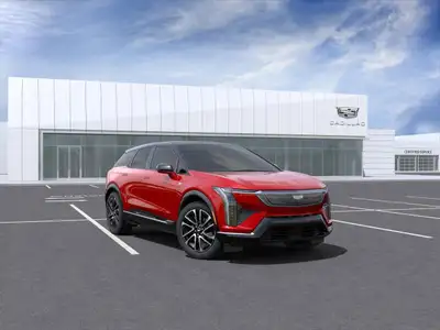 Introducing the 2025 Cadillac OPTIQ Sport AWD 4dr Sport w/1SF, a vibrant red SUV designed for those...