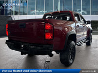 Get behind the wheel in our used 2021 Chevrolet Colorado ZR2 Crew Cab short box 4X4 in Cherry Red Ti... (image 4)