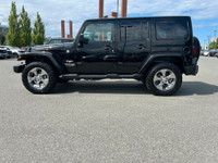 This 2018 Jeep Wrangler Sahara has a Black Exterior and Black Interior with seating for 5. Equipped... (image 1)