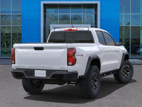 The 2025 Chevrolet Colorado ZR2, presented in Summit White with a Jet Black/Artemis interior, is eng... (image 7)