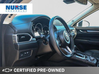 This 2022 Mazda CX-5 GS SUV boasts a sleek blue exterior and a sophisticated black leatherette inter... (image 8)
