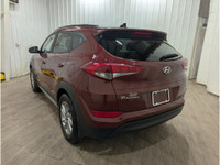 Experience the bold blend of performance and style with the striking Red Hyundai Tucson SE featuring... (image 4)