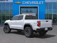 The 2025 Chevrolet Colorado ZR2, presented in Summit White with a Jet Black/Artemis interior, is eng... (image 5)