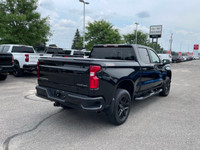 The 2022 Chevrolet Silverado 1500 LTD Custom Trail Boss in an adventurous black finish, powers throu... (image 5)