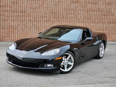 This isn’t just a car—it’s a statement. Draped in sleek black-on-black with polished chrome wheels t...