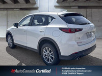 This 2025 Mazda CX-5 boasts a pristine white exterior and is ready for its next adventure, a fresh t... (image 4)