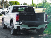 The *2023 GMC Sierra 1500 Denali Ultimate* is a pre-owned powerhouse that effortlessly blends bold d... (image 7)