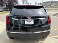 The 2024 Cadillac XT5 Luxury in Stellar Black Metallic combines refined styling with practical perfo... (image 6)