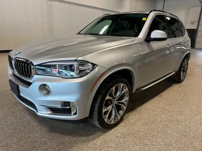 Our 2015 BMW X5 xDrive35i gives you the comfort of an SUV and the spirit of a sports car in Silver M...