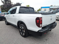 LOW KMS! RIDGELINE TOURING 4X4! FULL OPTION! LEATHER INTERIOR, POWER SUNROOF/MOONROOF, GPS NAVIGATIO... (image 1)