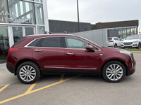 The 2017 Cadillac XT5 Platinum in Red Passion Tintcoat delivers all-wheel drive performance powered... (image 8)