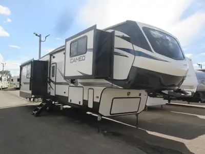 Sleeps 4, 4 Slides, 2 Awnings, Auto Levelling System, 2 Fireplaces, 2 AC units and 2 Recliners w/Hea...