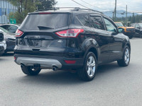 This 2019 Ford Escape SE has a Tuxedo Black exterior and Charcoal Black seats with seating for 5. Eq... (image 7)