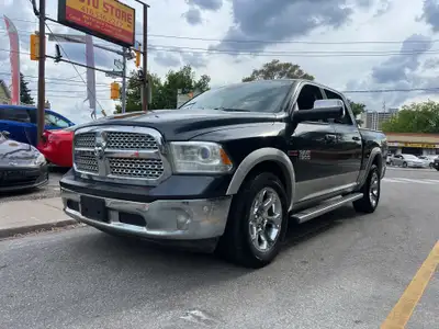 2014 Ram 1500 4WD Crew Cab Laramie Loaded with luxury and power, this full-size pickup features prem...