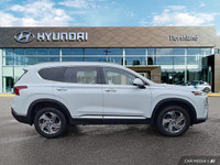 Experience the 2023 Hyundai Santa Fe Preferred SUV, boasting a stunning Quartz White exterior and bl... (image 5)