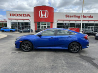 This Aegean Blue Metallic 2021 Honda Civic Sedan Sport is a head-turner. Boasting a low 39,352 kilom... (image 7)