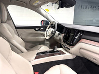 The 2022 Volvo XC60 Momentum blends luxury and performance seamlessly, offering a refined driving ex... (image 5)