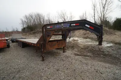 Come take a look at this 28in. gooseneck deck over trailer. It has 7000 lb tri-axles with stake pock...