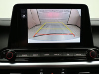 Experience refined performance and modern comfort with the 2024 Kia Forte 5 EXâ€”a sleek, sporty hat... (image 6)