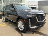 The 2021 Cadillac Escalade Luxury in Dark Moon Blue Metallic makes a bold statement with its 22-inch... (image 9)