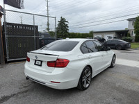 This 2014 BMW 320 is a sleek and reliable sedan that's sure to turn heads. With its stylish white ex... (image 5)