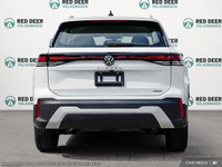 Experience the thrill of driving the new white 2025 Volkswagen Tiguan Comfortline 4MOTION, an SUV en... (image 4)