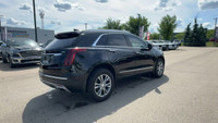 This Cadillac XT5 is equipped with: Leather Seating Surfaces w/Mini Perforated Inserts, Power moonro... (image 4)